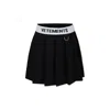 Vetements Black Skirt For Girl With Logo In Black