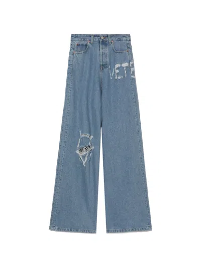Vetements Distressed Logo-detail Jeans In Blue