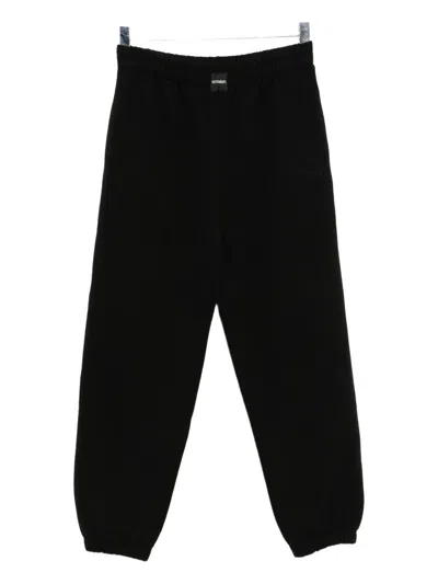 Vetements Logo-embroidered Trousers In Black