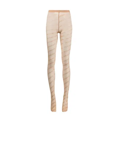 Vetements Logo-print Semi-sheer Tights In Nude