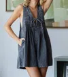 VEVERET PLEATED V-NECK DENIM ROMPER IN WASHED GREY
