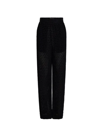 Victoria Beckham Geometric-pattern Curved-leg Trousers In Black