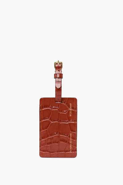 Victoria Beckham Luggage Tag In Brick Red Croc Embossed Leather In Burgundy