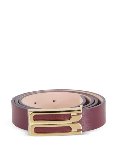 Victoria Beckham Maroon Solid Golden Logo Buckle Belt In Red
