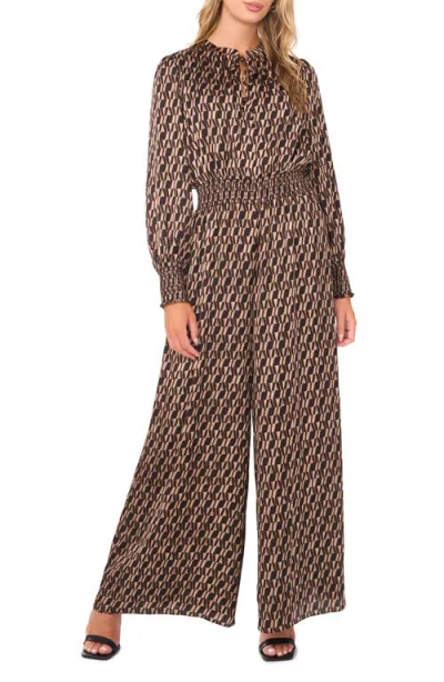 Vince Camuto Geo Print Long Sleeve Jumpsuit In Burgundy