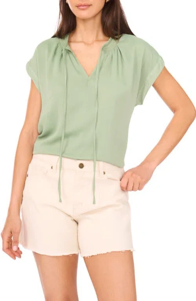 Vince Camuto Smocked Trim Tie Neck Peasant Top In Green