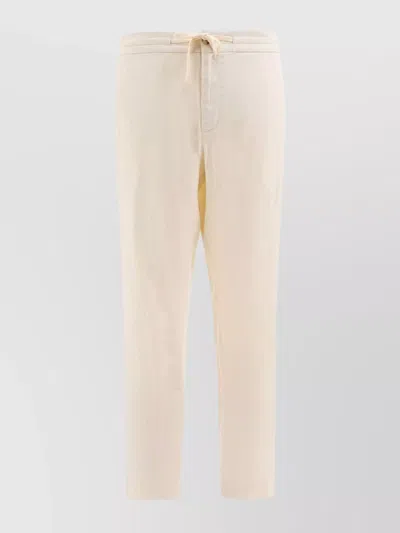 VINCE TAILORED TROUSERS WITH BACK POCKETS AND BUTTON DETAIL