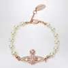 Vivienne Westwood Mini Bas Relief Pearl Bracelet Rose Gold In Pink