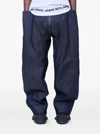 Walter Van Beirendonck Embossed-detail Jeans In Blue