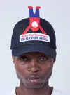 Walter Van Beirendonck Logo Motif Baseball Cap In Black