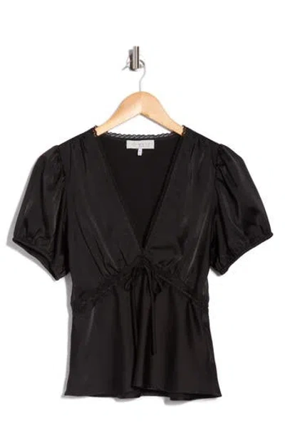 Wayf Puff Sleeve Peplum Top In Black