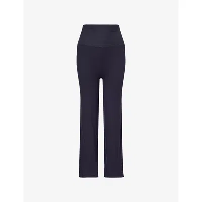 We Are Tala Omens 365 Sculpting-lounge Flared Stretch-jersey Trousers Washed Navy Xs In Blue