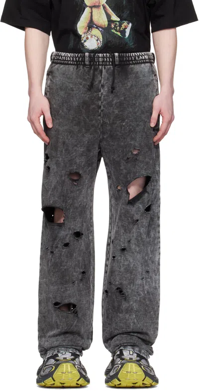 WE11 DONE BLACK DESTROYED JERSEY SWEATPANTS
