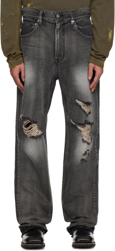 WE11 DONE BLACK RIPPED JEANS