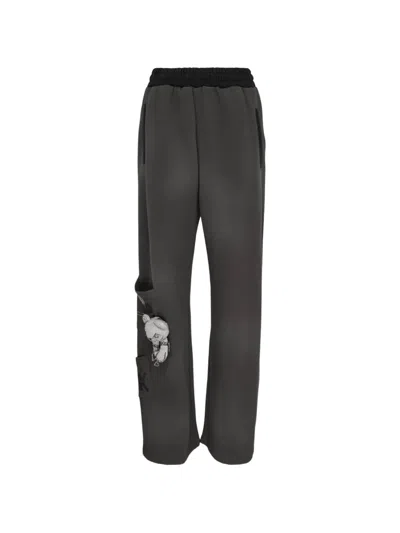 WE11 DONE DOODLE TEDDY LOGO-PRINT TRACK PANTS