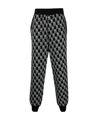 WE11 DONE LOGO JACQUARD KNITTED TROUSERS