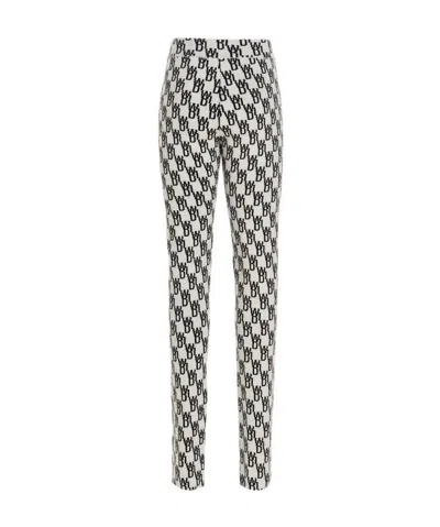 WE11 DONE LOGO PATTERN KNITTED LEGGINGS