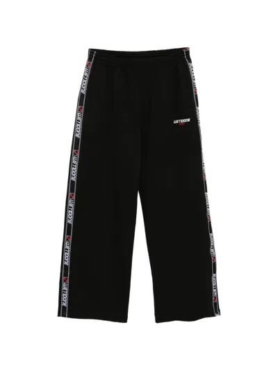 We11 Done Logo-tape Trousers In Black
