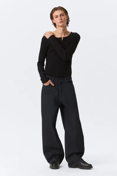 Weekday Astro Mid Rise Loose Baggy Leg Coated Jeans In Black