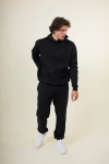 While On Earth™ Basis Hoodie In Black
