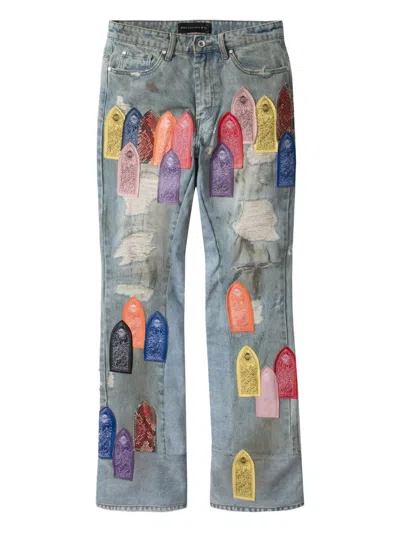 WHO DECIDES WAR PATCH ARCHED REPAIRED JEANS