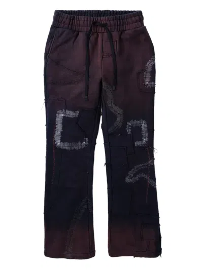 Who Decides War Patchwork Track Pants In Black