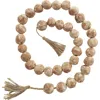 Willow Row Ceramic & Tassel Garland In Brown