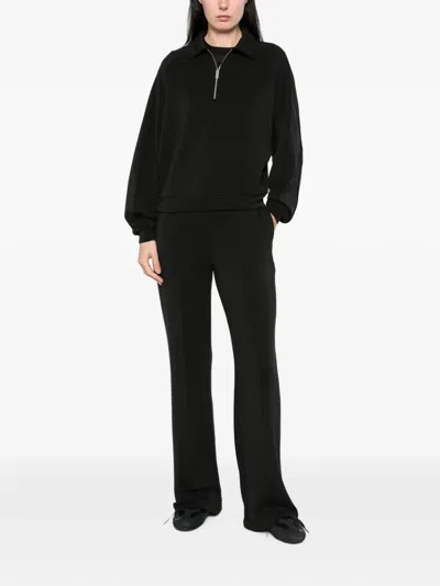 Woc Pressed-crease Flared Trousers In Black