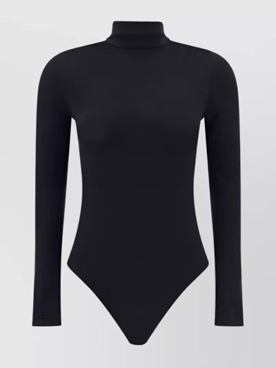 Wolford Seamless Fitted Turtleneck Long-sleeved Top In Black