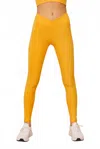 Wolven Ruched Active Crossover Pocket Legging In Mango In Yellow