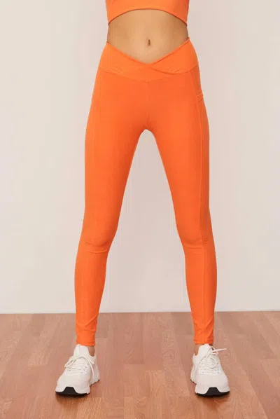 Wolven Ruched Crossover Pocket Legging In Tangerine In Orange
