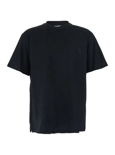 WOOYOUNGMI BLACK CREWNECK T-SHIRT WITH LOGO PATCH ON THE FRONT AND FLORAL MOTIF ON THE REAR IN COTTON MAN