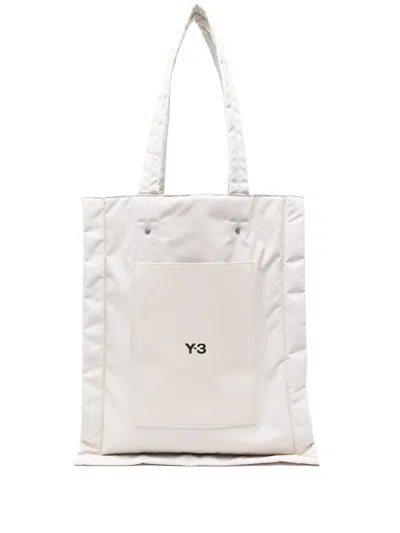 Y-3 LOGO-PRINT PADDED TOTE BAG