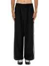 Y-3 Loose Black Jogger Pants With Adjustable Drawstring And Striped Details In Black