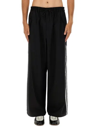 Y-3 LOOSE BLACK JOGGER PANTS WITH ADJUSTABLE DRAWSTRING AND STRIPED DETAILS