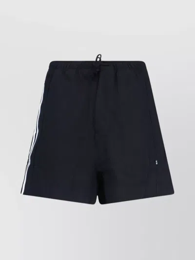 Y-3 STRAIGHT SHORTS WITH BACK POCKET AND SIDE STRIPES