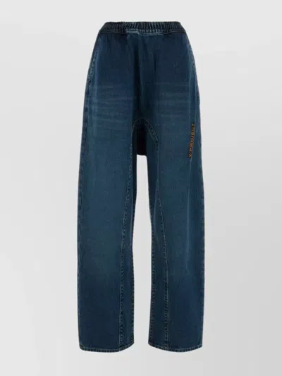 Y/PROJECT WIDE LEG DENIM TROUSERS WITH EMBROIDERED DETAIL