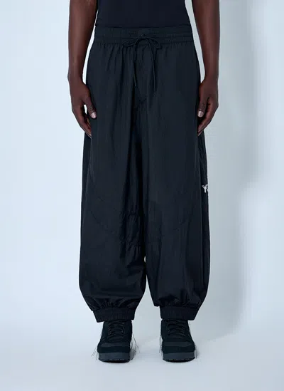 Y-3 Raw Edge 3 Stripes Nylon Shell Pants In Black