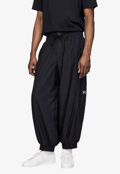 Y-3 Raw Edge 3-stripes Shell Track Pants In Black