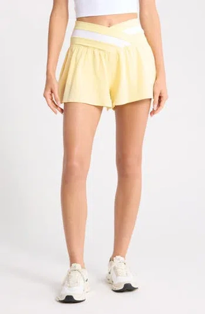 Yogalicious Lux Fiona Lightstreme Hybrid Crossover Waist Shorts In Yellow