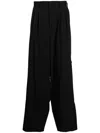 Yohji Yamamoto Loose-fit Pleat-detail Trousers In Black