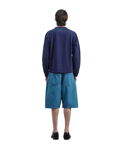 Youmustcreate Indigo Twisted Denim Shorts In Blue