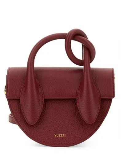 Yuzefi Logo Printed Foldover Top Shoulder Bag In Red