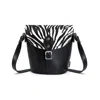 ZATCHELS WOMEN'S BLACK / WHITE HANDMADE LEATHER BARREL BAG - ZEBRA PRINT