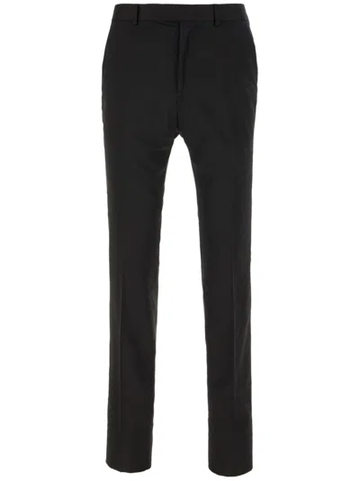 ZEGNA PRESSED-CREASE TAPERED TROUSERS