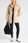 Zella Hybrid Faux Shearling Pocket Jacket In Tan Oxford