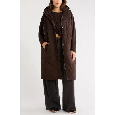Zella Long Hooded Puffer Vest In Brown Mole