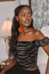 Zemeta Black Rose Satin Rosette Off-the-shoulder Puff Sleeve Top In Black