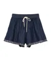 Zimmermann Rhiannon Drawstring Waist Fringe Hem Denim Shorts In Indigo