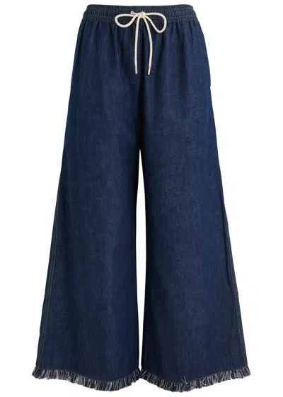 ZIMMERMANN ZIMMERMANN RHIANNON FRINGE-TRIMMED DENIM TROUSERS